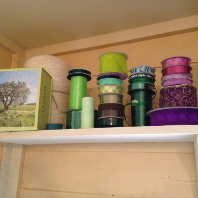 I store my ribbons spools on a shelf that my mom and dad made for me, above the window area.  